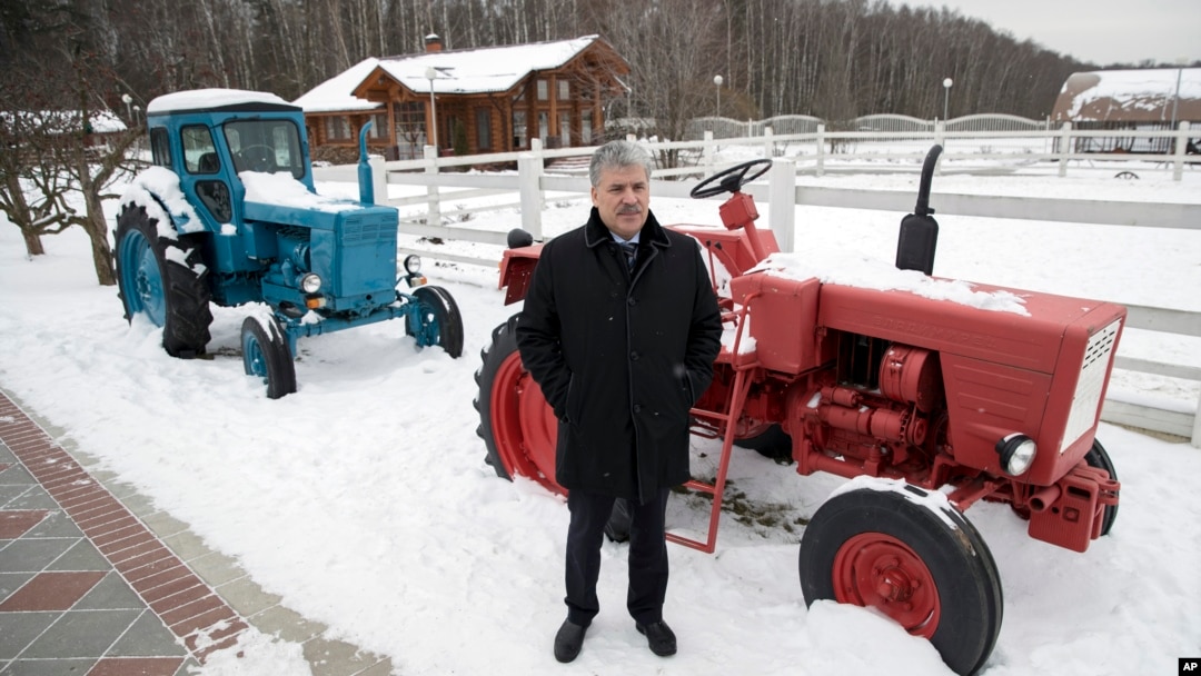 he Communist Party's candidate for the 2018 Russian presidential election Pavel Grudinin poses for a picture with old Soviet-made tractors, at Lenin state farm outside Moscow, Russia, Jan. 26, 2018.