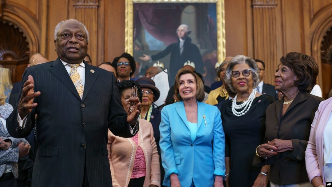 From left, Majority Whip James Clyburn, D-S.C., Speaker of the House Nancy Pelosi, D-Calif., Rep. Joyce Beatty, D-Ohio, and Rep. Maxine Waters, D-Calif., and members of the Congressional Black Caucus celebrate the passage of the Juneteenth Act.