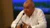 FILE - Dmitry Kiselyov, head of the official Russian state news agency Rossiya Segodnya, gestures during a press conference in Moscow on May 26, 2014.