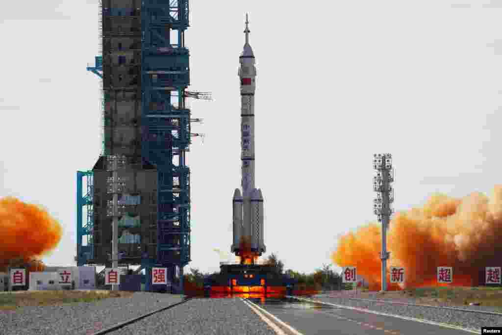 The Long March-2F Y12 rocket, carrying the Shenzhou-12 spacecraft and three astronauts, takes off from Jiuquan Satellite Launch Center for China&#39;s first manned mission to build its space station, near Jiuquan, Gansu province.