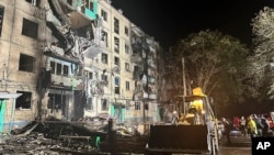 Архівне фото Національної поліції України - наслідки удару росіян по житловому будинку в Харкові, Україна, 2 жовтня 2024 року. У звіті ООН, опублікованому 8 січня 2025 року, Росію звинувачено у проведенні політики масового знищення проти України.