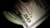  FILE - A $1 note is seen in this June 22, 2017, photo.