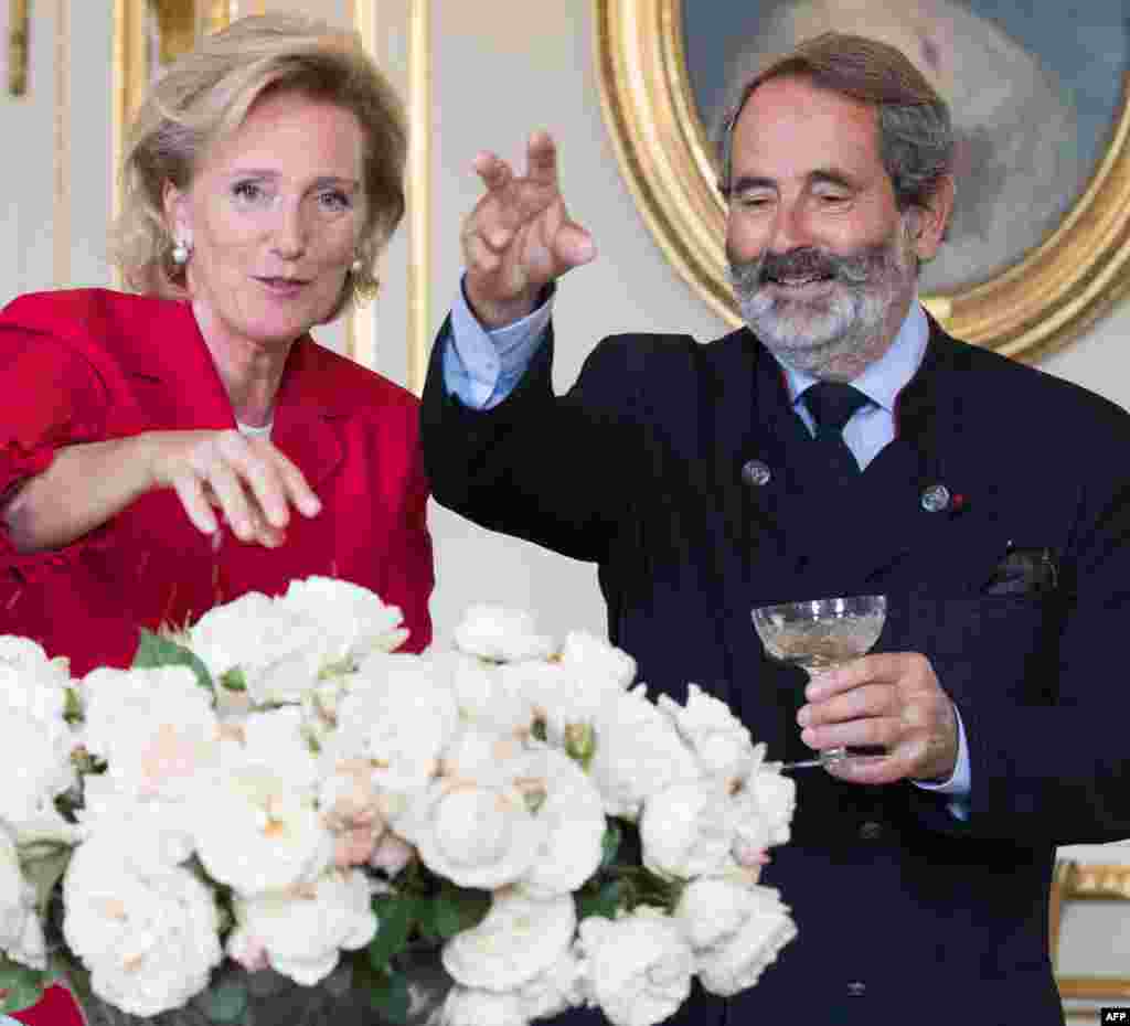 Princess Astrid of Belgium poses with a new species of rose, developed by Pepinieres et Roseraies Georges Delbard, named after her during a ceremony at the Belgian Royal Palace, in Brussels.