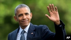 FILE - President Barack Obama walks across the South Lawn of the White House, in Washington, July 5, 2016.
