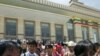 Pro-democracy leader Aung San Suu Kyi (C) walks after a parliament session in the lower house of parliament, in Naypyitaw, Burma, May 2, 2012.