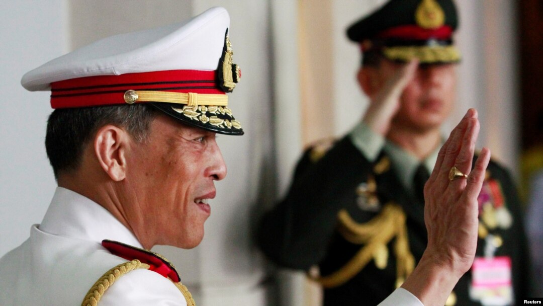 FILE - Thailand's Crown Prince Maha Vajiralongkorn waves to well-wishers who had gathered to see King Bhumibol Adulyadej before he departed to the Grand Palace from Siriraj Hospital to take part in his coronation anniversary ceremonies in Bangkok, Thailand May 5, 2010. 