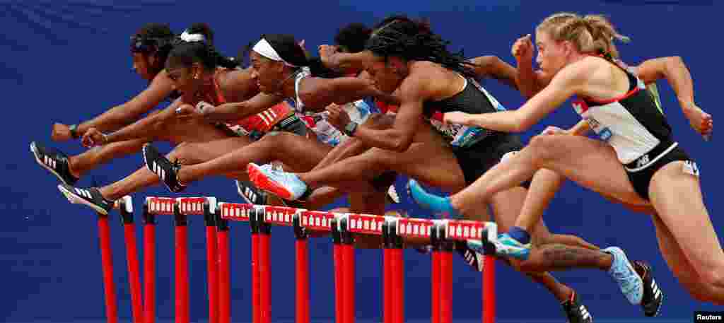 Athletes compete during the Diamond League women's 100m hurdles final at the London Stadium.