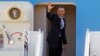 President Barack Obama waves prior to boarding Air Force One before departing form Andrews Air Force Base, in Md., March. 15, 2013.