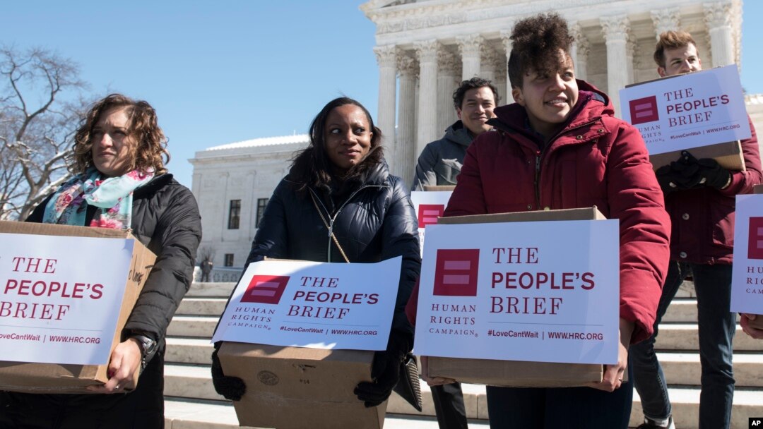 Members of the Human Rights Campaign deliver "People's Brief" with more than 200,000 signatures in support of marriage equality to the Supreme Court in Washington, March 6, 2015.