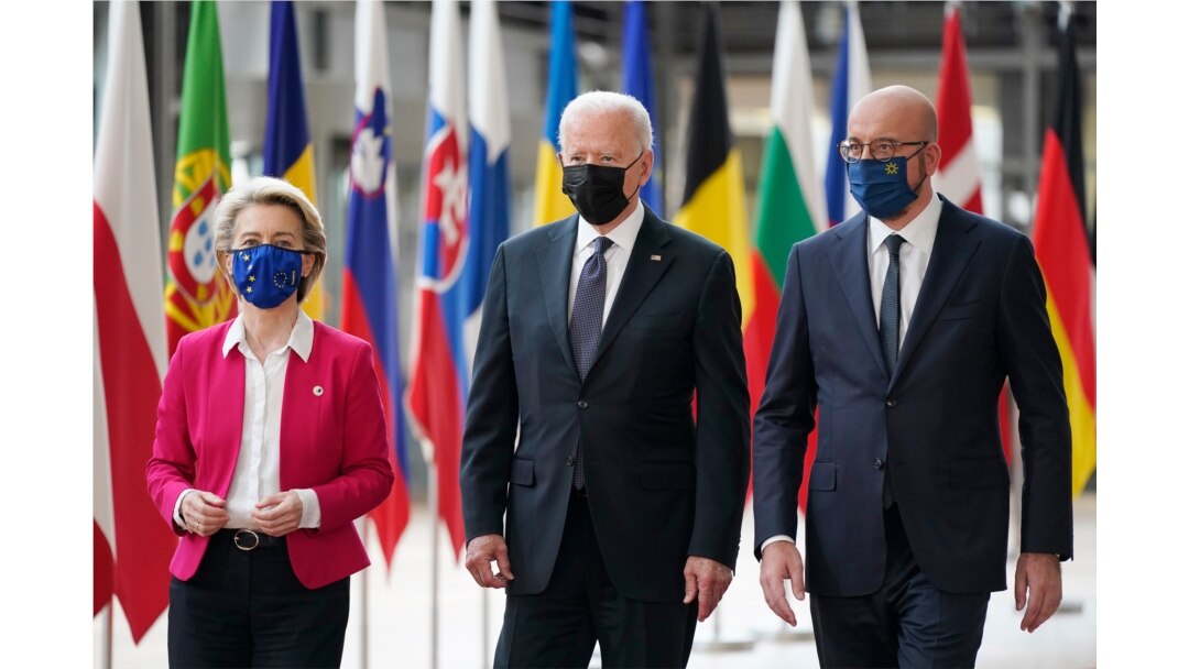 President Joe Biden, center, walks with European Council President Charles Michel, right, and European Commission President Ursula von der Leyen, during the United States-European Union Summit at the European Council in Brussels, June 15, 2021.