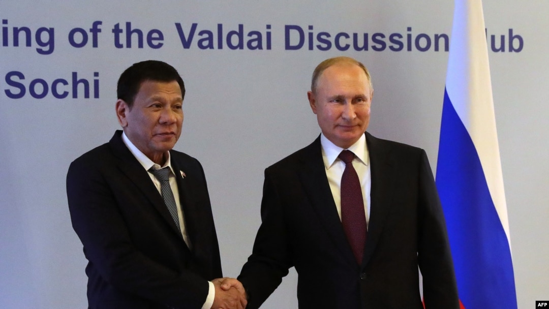 Russian President Vladimir Putin (R) shakes hands with Philippine's President Rodrigo Duterte prior to their meeting at the Valdai Discussion Club in Sochi, Russia, Oct. 3, 2019.