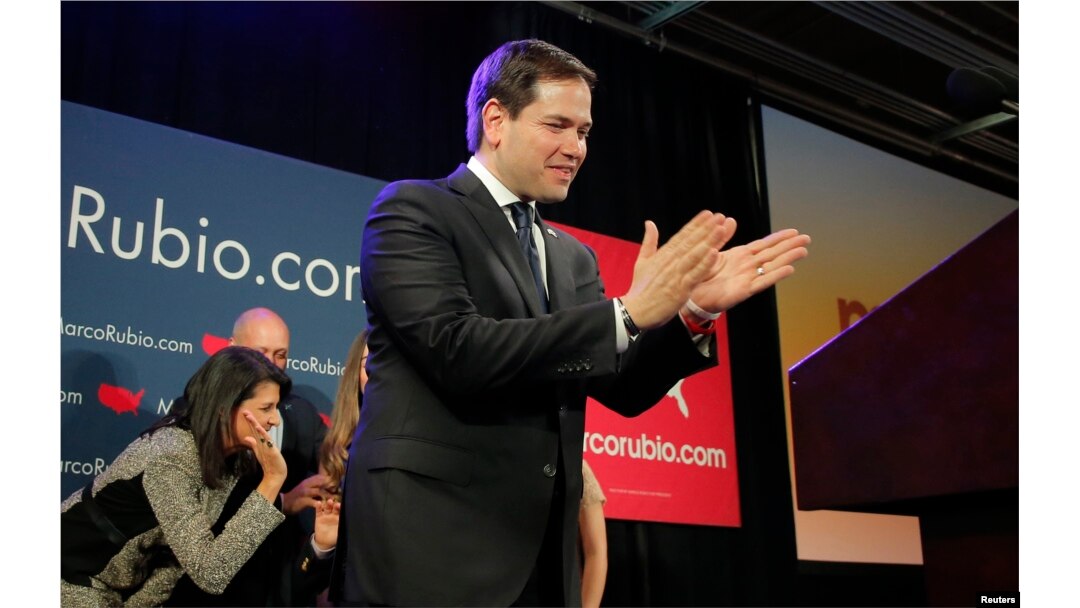 U.S. Republican presidential candidate Marco Rubio applauds as he approaches the podium to speak to supporters at a South Carolina primary night rally in Columbia, S.C., Feb. 20, 2016.