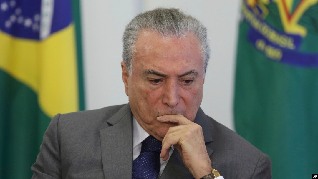 FILE - Brazil's President Michel Temer attends a ceremony at the Planalto presidential palace, in Brasilia, Brazil, April 12, 2017.