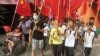 Villagers including schoolchildren take part in a protest march, demanding the release of their village chief Lin Zulian, in Wukan, in China's Guangdong province, June 21, 2016. 