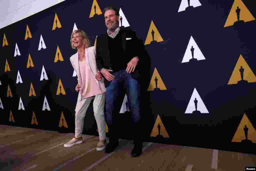 Cast members John Travolta and Olivia Newton-John dance at a 40th anniversary screening of "Grease" at the Academy of Motion Picture Arts and Sciences in Beverly Hills, California, Aug. 15, 2018.