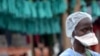 FILE - A health worker stands at Elwa hospital in Monrovia, Sept. 7, 2014.