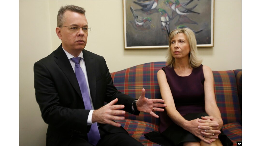 Pastor Andrew Brunson, left, gestures as his wife, Norine, listens during an interview at the headquarters of Christian Broadcasting Network in Virginia Beach, Va., Oct. 19, 2018. Brunson was recently released from prison in Turkey.