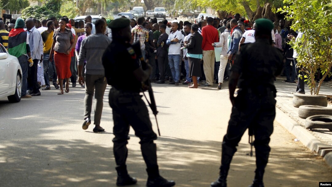 FILE - Policemen stand guard as supporters of Indigenous People of Biafra leader Nnamdi Kanu rally in Abuja, Nigeria Dec. 1, 2015. 