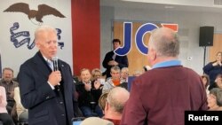 Democratic 2020 U.S. presidential candidate and former U.S. Vice President Joe Biden faces off with a local resident challenging him about his son Hunter Biden's involvement with Ukraine in this screen grab made from video shot during a campaign event.