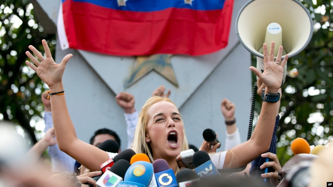 FILE - Lilian Tintori, wife of jailed opposition leader Leopoldo Lopez, speaks to her husband supporters in Caracas, Venezuela, Sept. 11, 2015. Bill, which was approved late Tuesday, would free more than 70 people who have spoken out against Maduro and his predecessor, the late Hugo Chavez. 