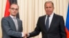 Russian Foreign Minister Sergey Lavrov, right, shakes hands with German Foreign Minister Heiko Maas after their joint news conference following talks in Moscow, Russia, May 10, 2018.