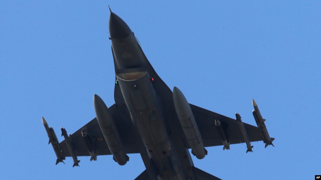 FILE - A missile-loaded Turkish Air Force jet after taking off from Incirlik Air Base, in Adana, southern Turkey, July 29, 2015. 