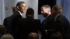 U.S. President Barack Obama (L) shakes hands at the Business Roundtable in Washington, where he renewed his call for tax hikes on the wealthiest 2 percent of Americans and for an increase in the nation's borrowing limit, December 5, 2012.