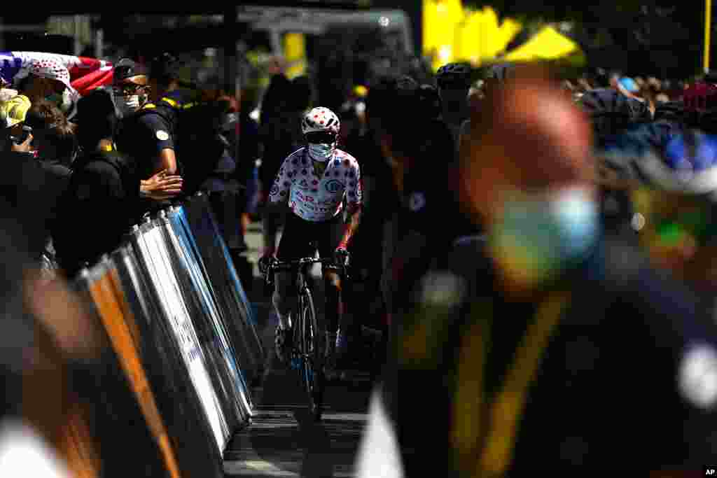 Colombia's Nairo Quintana, wearing the best climber's dotted jersey, arrives for the start of the 13th stage of the Tour de France cycling race over 219.9 kilometers (136.6 miles) with start in Nimes and finish in Carcassonne, France.