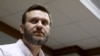 FILE - Russian anti-corruption campaigner and prominent opposition figure Alexei Navalny is seen attending a hearing at the Moscow City Court in Moscow, Russia, Feb. 12, 2016. 