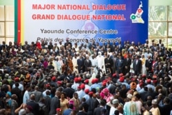 People gather at the Congress Palace during the opening session of the National Dialogue called by President Paul Biya, in Yaounde, Cameroon, Sept. 30, 2019.