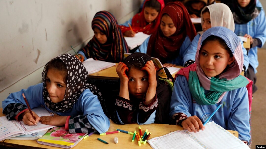 FILE - Afghan girls attend a class at the Aschiana center in Kabul, Afghanistan March 5, 2019. 
