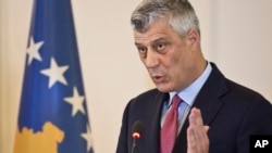 FILE - Kosovo President Hashim Thaci reacts during a press conference in Pristina, Kosovo, March 8, 2017. 