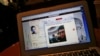 FILE - A screen shot shows Chinese Patriotic Blogger Zhou Xiaoping's Sina Weibo account, in Beijing, China, Oct. 23, 2014. China’s proposal that would require companies to register Internet domain names domestically is raising concerns about tightening of Internet rules.