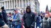 Four Charged with Attacks on Media During Capitol Riot 