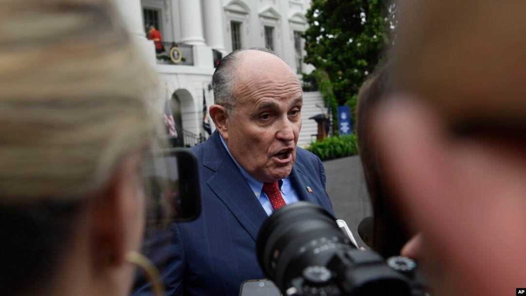 FILE - President Donald Trump's lawyer Rudy Giuliani speaks to reporters on the South Lawn of the White House in Washington, May 30, 2018.
