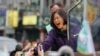 Taiwan's opposition Democratic Progressive Party, DPP, presidential candidate Tsai Ing-wen greets supporters from the back of a truck as she parades through the streets of New Taipei City, Taiwan, Friday, Jan. 15, 2016.