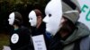 Climate activists hold placards reading "Blah Blah Blah" to mock statements by world leaders during a protest at Festival Park in Glasgow on the sidelines of the COP26 UN Climate Summit on Nov. 1, 2021.