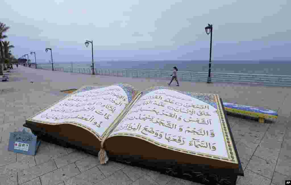 A large representation of the Quran, Islam's holy book, is displayed on the Mediterranean seafront promenade, during the Islamic holy month of Ramadan, in Beirut, Lebanon.