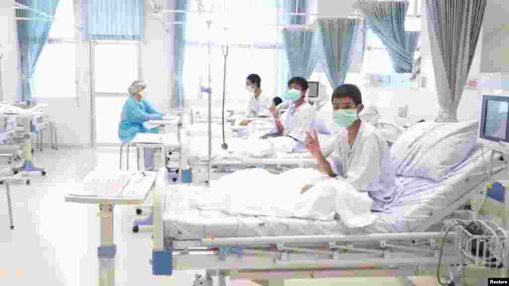 A screen grab shows boys rescued from the Thai cave wearing mask and resting in a hospital in Chiang Rai, Thailand. (Credit: Government Public Relations Department (PRD) and Government Spokesman Bureau)