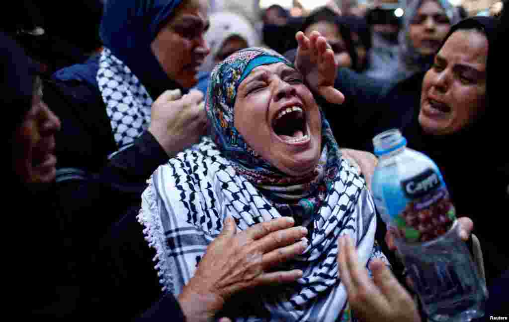 A relative mourns during the funeral of Palestinian nurse Razan Al-Najar, who according to health officials and a witness, was killed by Israeli forces as she tried to help a wounded protester at the Gaza border, in Khan Younis in the southern Gaza Strip, June 2, 2018.