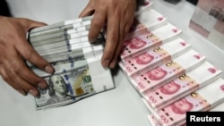 美国当选总统川普竞选时提出的列中国为货币操纵国和增加关税政策，令中国紧张