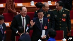 正在北京列席及参与人大、政协两会的香港特首李家超