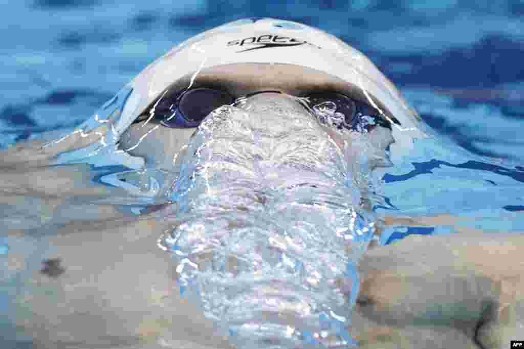 Russia's Evgeny Rylov competes in a heat for the men's 200m backstroke swimming event during the Tokyo 2020 Olympic Games at the Tokyo Aquatics Center in Tokyo, Japan.