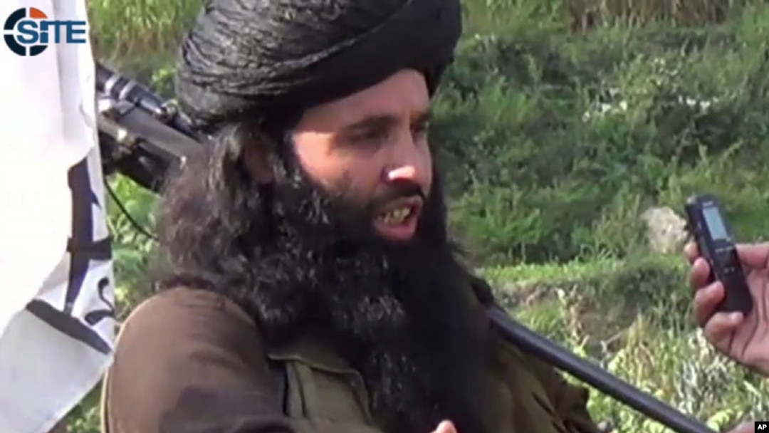 FILE - This undated image provided the SITE Intel Group, an American private terrorist threat analysis company, shows Mullah Fazlullah in Pakistan. 