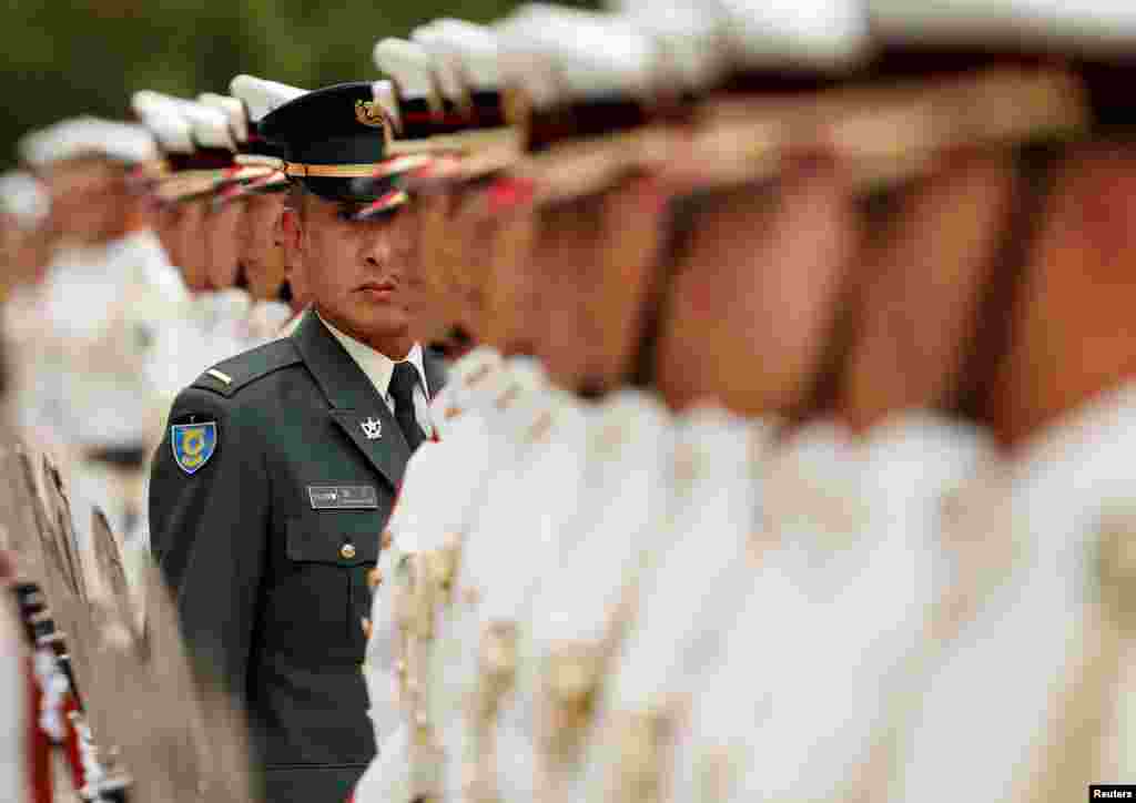 Members of Japan's Self-Defence Forces' honour guard prepare for a ceremony for new U.S. Indo-Pacific military commander Adm. Phillip Davidson at the Defense Ministry in Tokyo, Japan.