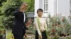 U.S. President Barack Obama and Burma's pro-democracy leader Aung Sann Suu Kyi meet at Suu Kyi's home in Rangoon, November 19, 2012.