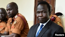 FILE - Thomas Kwoyelo, a mid-level commander in the Lord's Resistance Army (LRA) sits in the dock at the International Crimes Division court sitting in Gulu, Uganda, Oct. 25, 2024. 