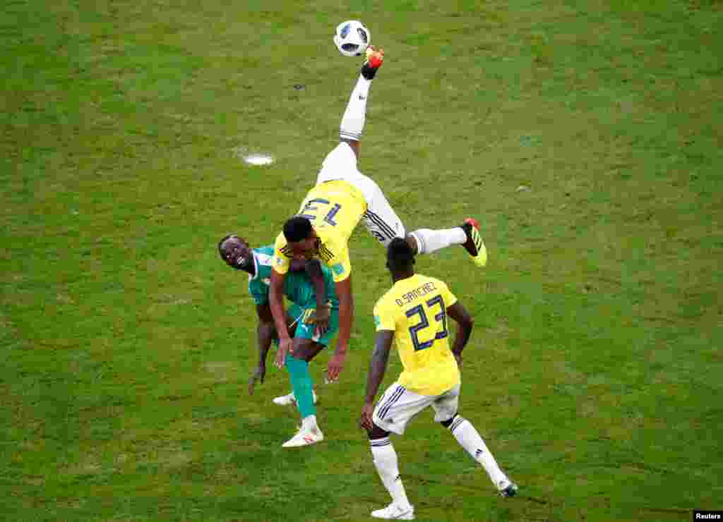 Colombia's Yerry Mina jumps for the ball during the group H match between Senegal and Colombia, at the 2018 soccer World Cup in the Samara Arena in Samara, Russia.
