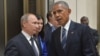 Russian President Vladimir Putin, left, listens to U.S. President Barack Obama in Hangzhou in eastern China's Zhejiang province, Sept. 5, 2016.