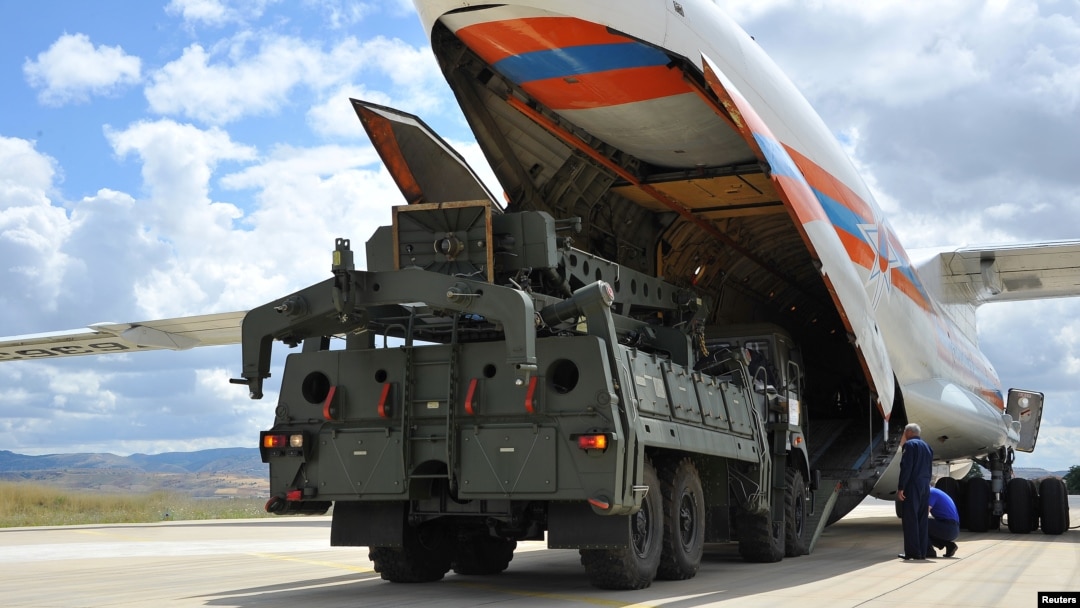 FILE - First parts of a Russian S-400 missile defense system are unloaded from a Russian plane near Ankara, Turkey, July 12, 2019.